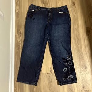 Blue jeans with purple floral embroidery